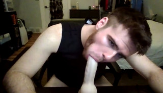 Boy, he loves sucking a dildo