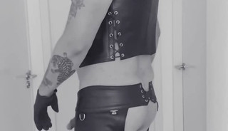 Leatherstudx in very tight leatherchaps, tattooed, pierced and big fat cock!