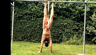 naked pathetic slave during outdoor party tied up at his testicles entertain the guests,CMNM