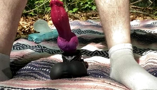 Riding huge toy and shooting Big Cumshot in the Forest