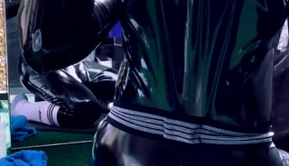 Rubber twink enjoys cock in his hole