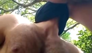 Masked man having sex in the forest