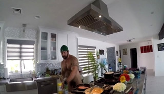 Hairy muscle god cooking in nature's garb