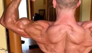 Adam Charlton flexing his muscles