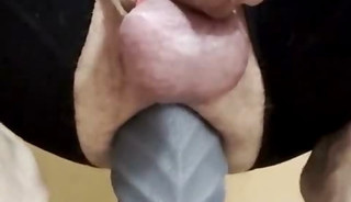 Anal stretch training with caged cock makes mature whore happy