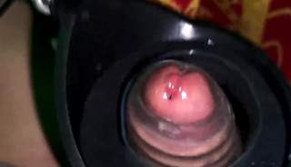 A jerk-off robot tests the stamina of a large penis.