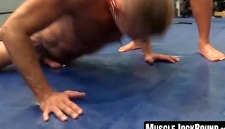 Collared Colin Steele performs push-ups for master