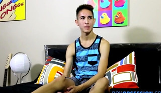 Young guy interviewed before he starts stroking on his rod with pleasure