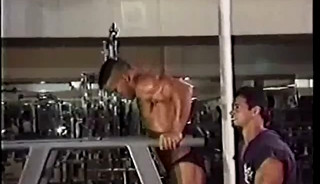 A Younger Jose Raymond Oiling Himself Up, Flexing and Posing, and Lifting Weights