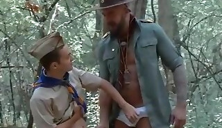 Boy and Scout Leader trade oral outdoors- ScoutBoyz